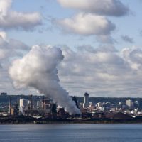 A smoking chimney in a cloudy sky, Toronto